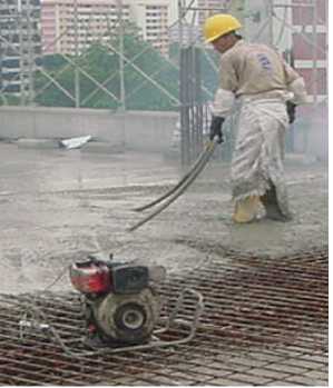 Figure 1 Compaction of concrete using vibration machine